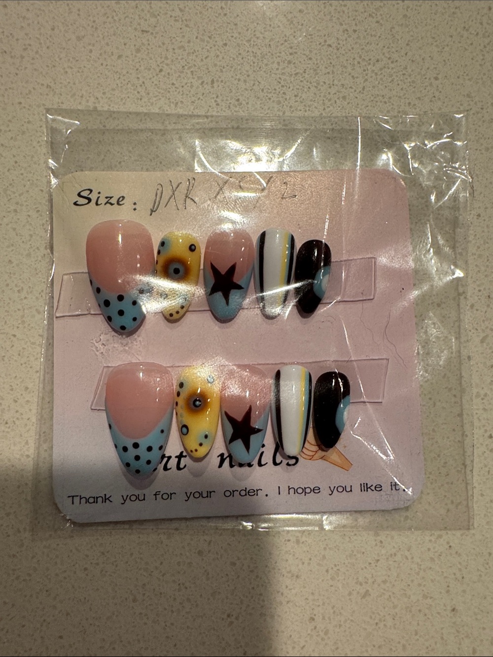 Press-On Nail Set — Pastel Blue, Yellow & Black Accent Design
